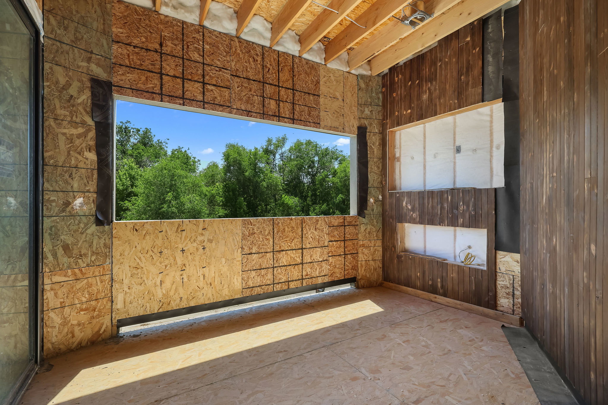 1 OF 2 OPEN PATIOS!  FIREPLACE TO BE INSTALLED!  SITS OF PRIMARY SUITE!  Framed opening providing an expansive outdoor panorama