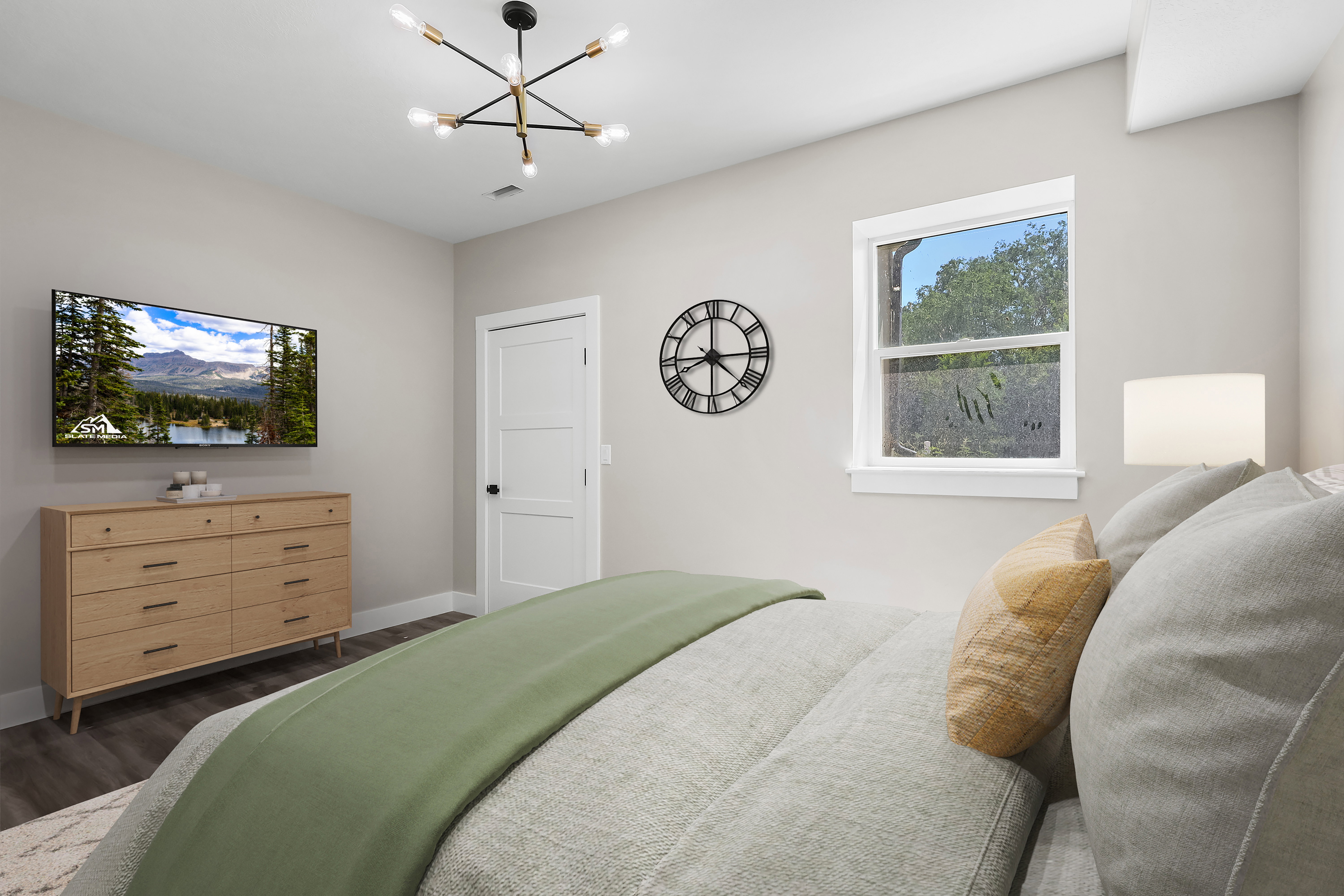 VIRTUALLY STAGED! Contemporary ceiling light fixture illuminating an interior space with a window, white trim, wood-finish flooring, and a three-panel interior door with dark hardware