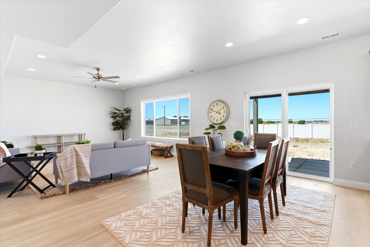 Open-concept living area with light wood-finish flooring