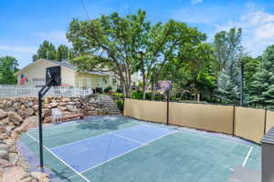 Multi-sport court with a durable surface and two basketball hoops