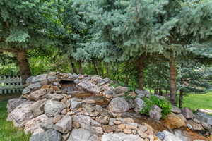 Terraced rock water feature with a flowing waterfall