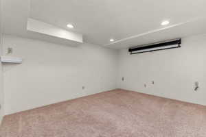 Neutral-toned carpeting enhancing the room's warm aesthetic