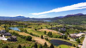 Wolf Creek Golf Course View.  Expansive aerial panorama showcasing a golf course landscape with multiple water features