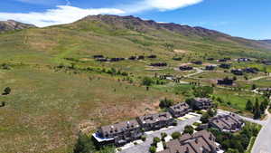 Townhome community set against a backdrop of rolling, green hills