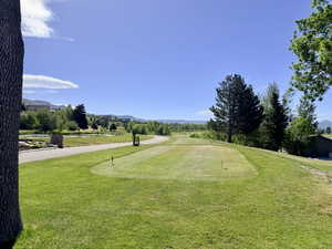 Wolf Creek golf course, winding cart path, water feature, and distant mountain ranges.  Walking distance.
