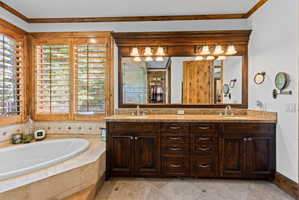 Dual vanity with wood-finish cabinetry and light-toned countertops