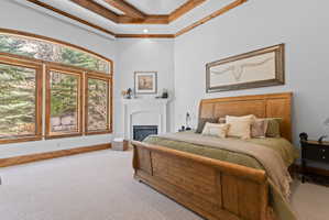 Expansive windows with wood trim and an arched transom