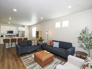 Open-concept living space featuring wood-finish flooring