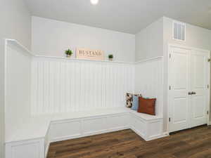 Built-in bench seating with wainscoting and storage compartments