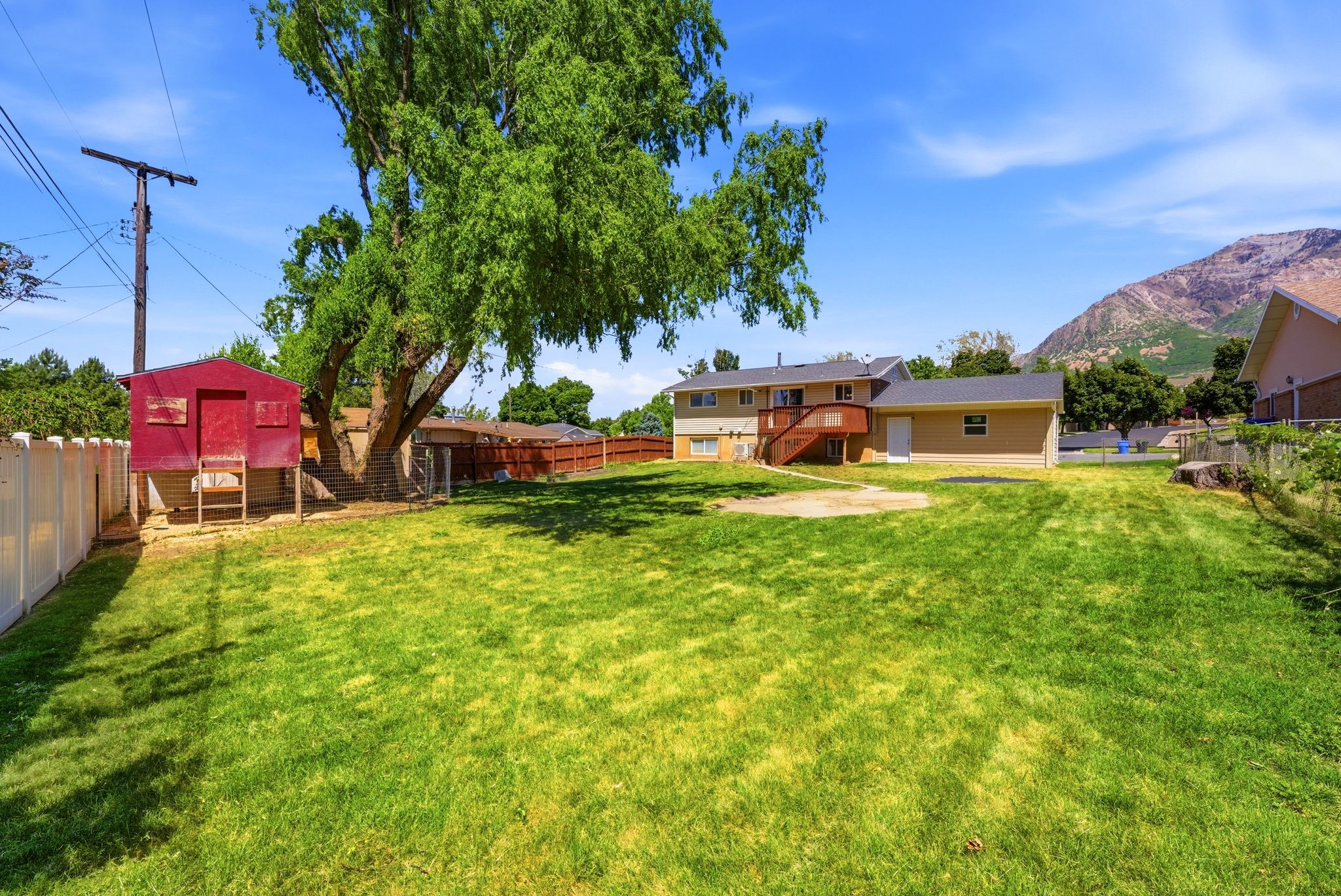 Expansive green lawn with mountain backdrop