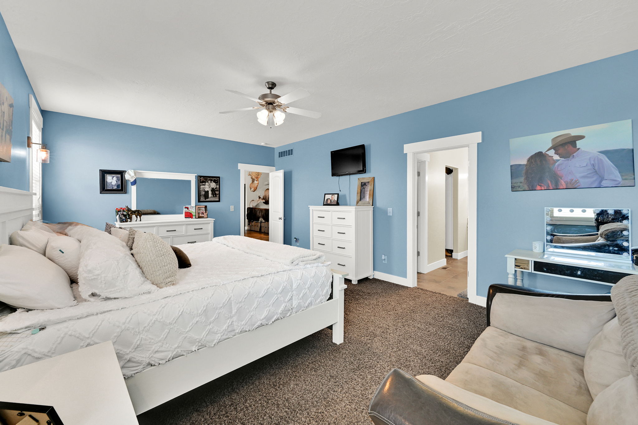 Carpeted bedroom with blue walls and white trim