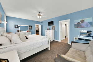 Carpeted bedroom with blue walls and white trim