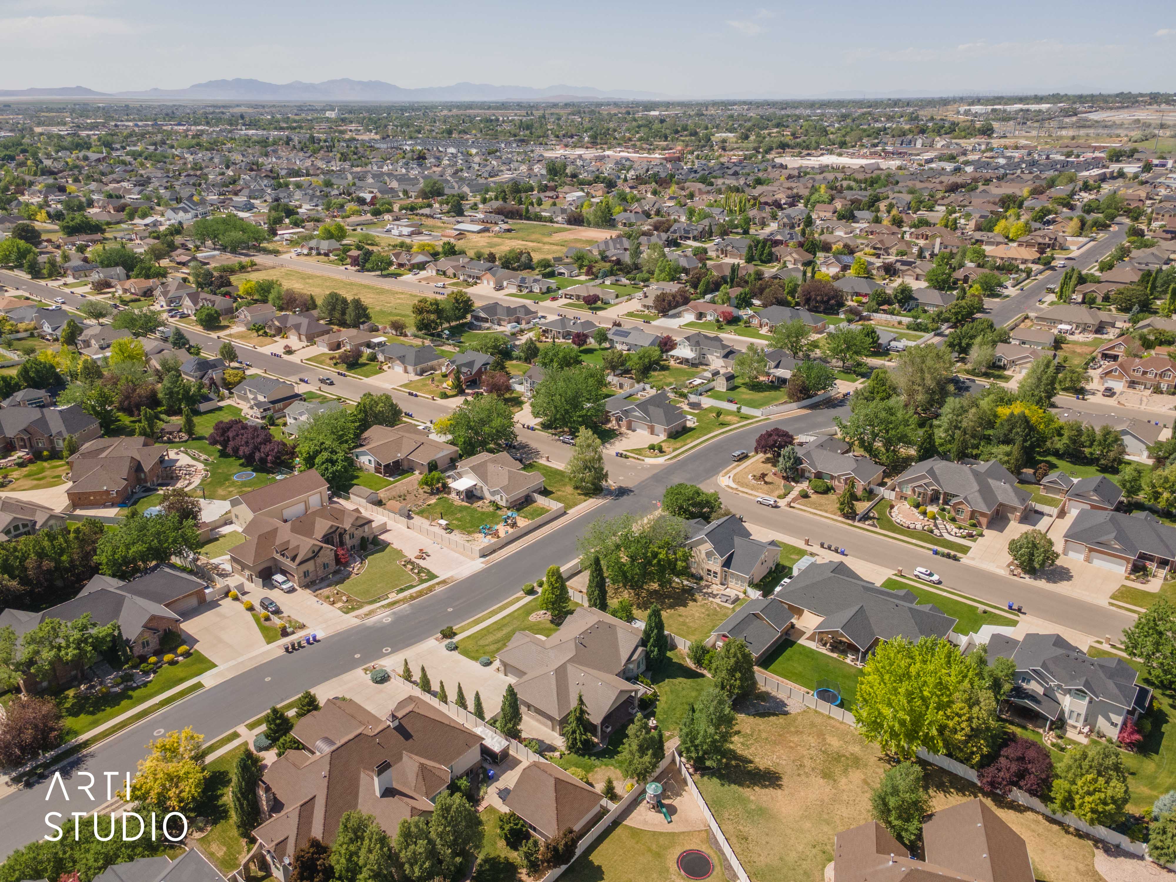 Sprawling residential neighborhood with established homes, mature landscaping, and paved streets