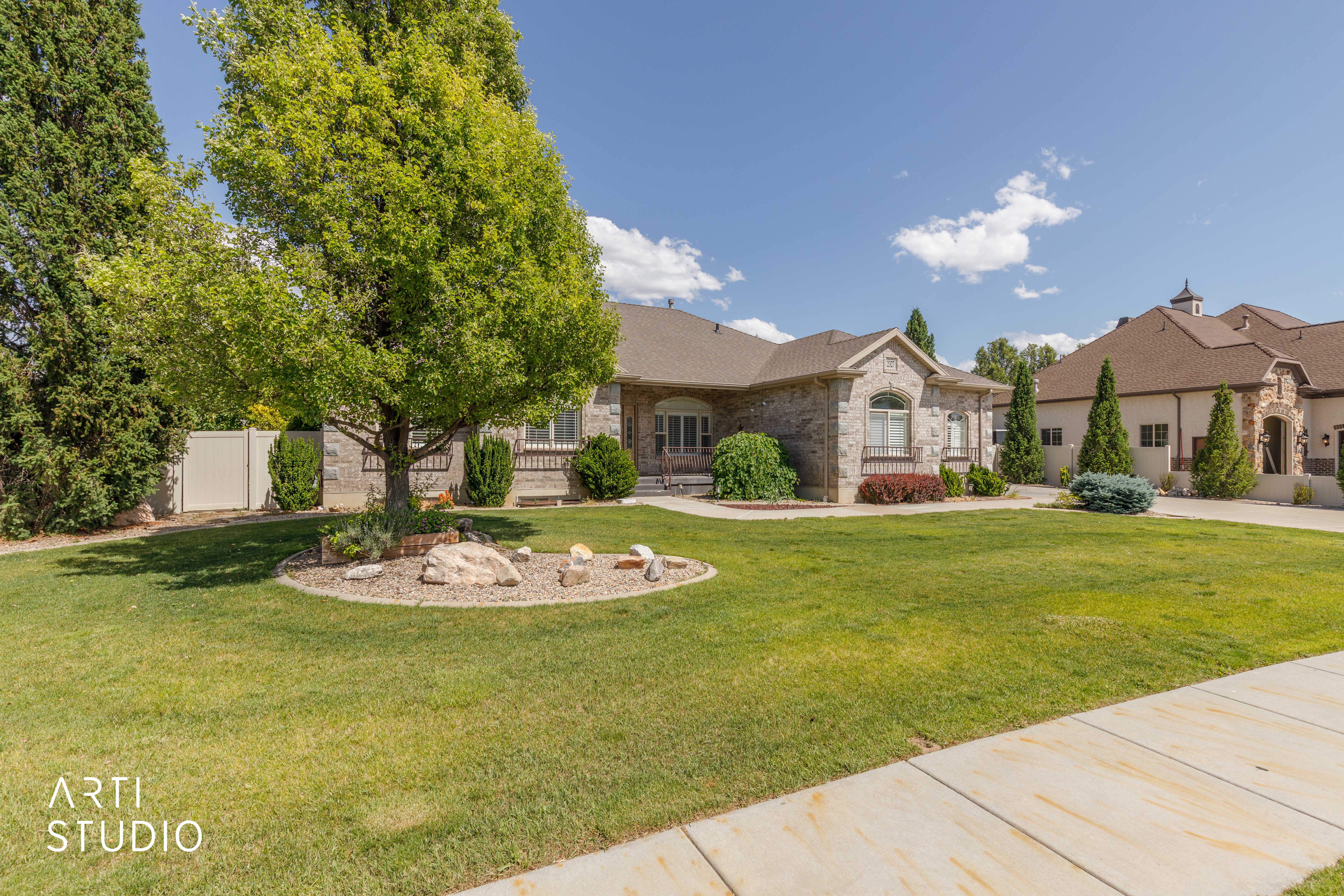 Stone veneer exterior with an arched window accent