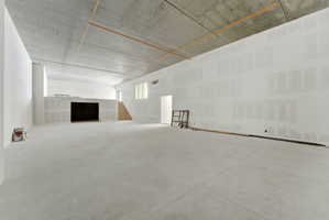 Sports court with overlook, interior and exterior access, and a large storage area.