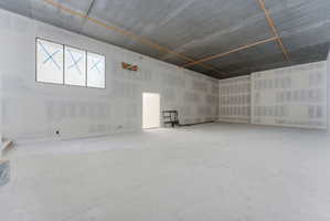 Sports court with overlook, interior and exterior access, and a large storage area.