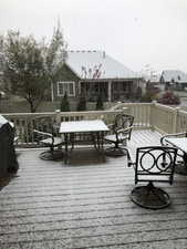 Expansive deck with wood-finish flooring and a full railing system