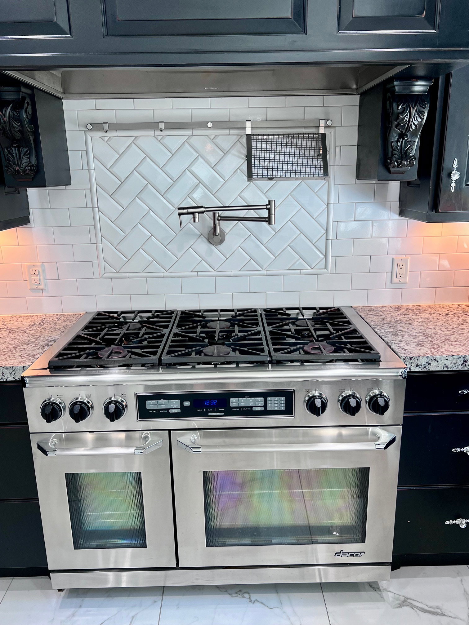 Stainless steel professional range featuring multiple burners and dual ovens
