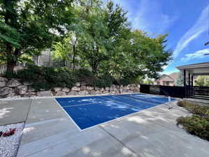 Outdoor sports court with a blue playing surface and white boundary lines