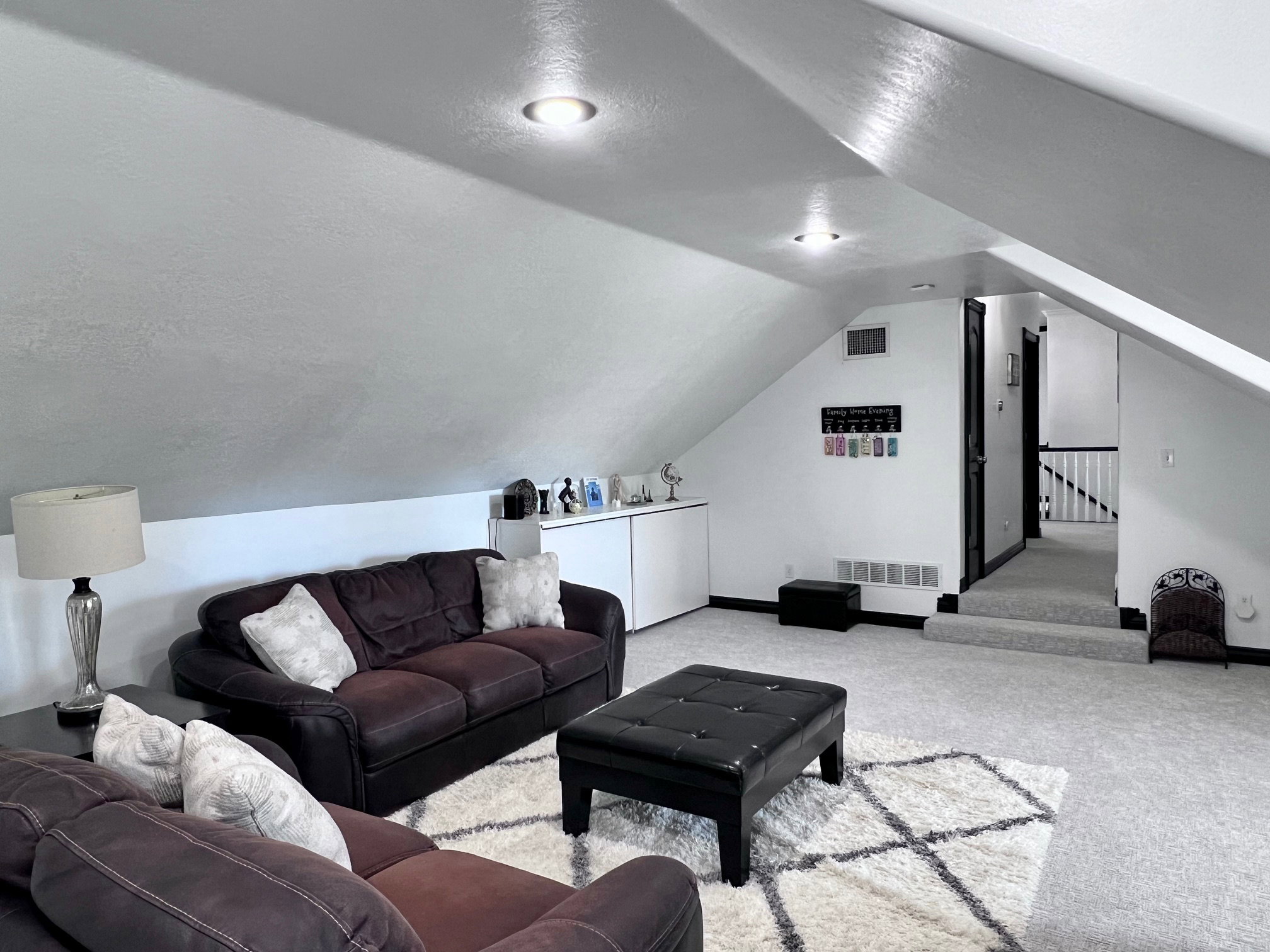 Carpeted bonus room with recessed lighting and sloped ceilings
