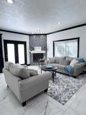 Spacious living area featuring polished marble-finish tile flooring, recessed lighting, and a corner fireplace with a decorative tile surround