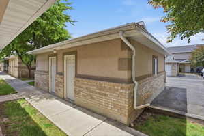Exterior building with stucco siding and brick veneer
