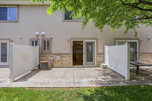 Concrete patio with a partial privacy fence