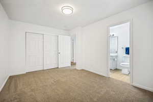 Master upstairs bedroom access to the main bath, six-panel closet doors, and recessed lighting