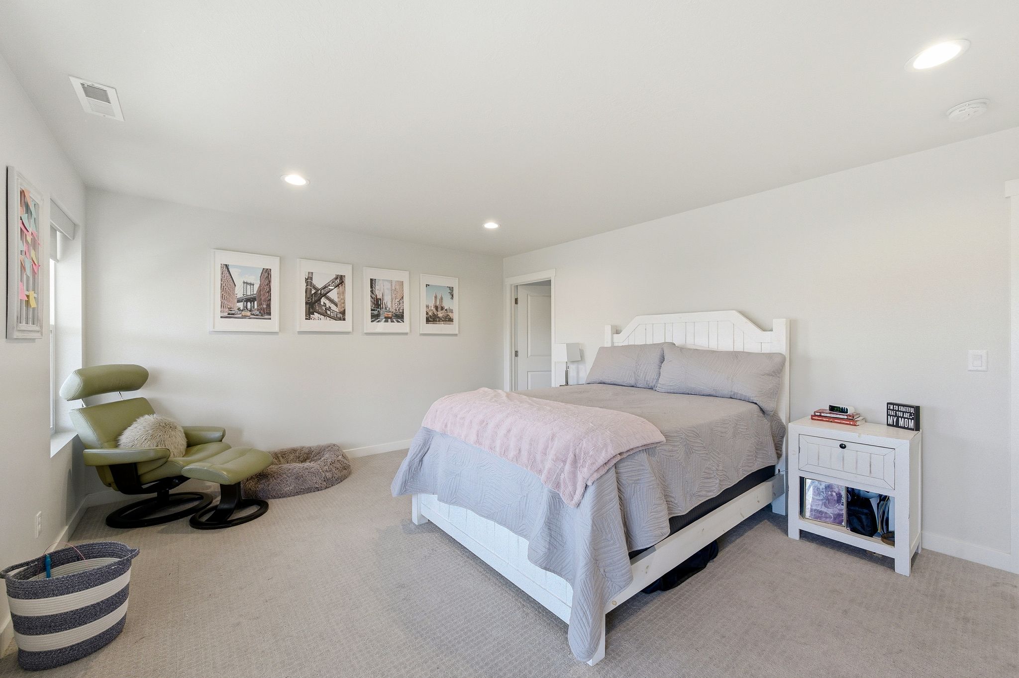 Spacious room featuring light gray wall paint and recessed ceiling lighting
