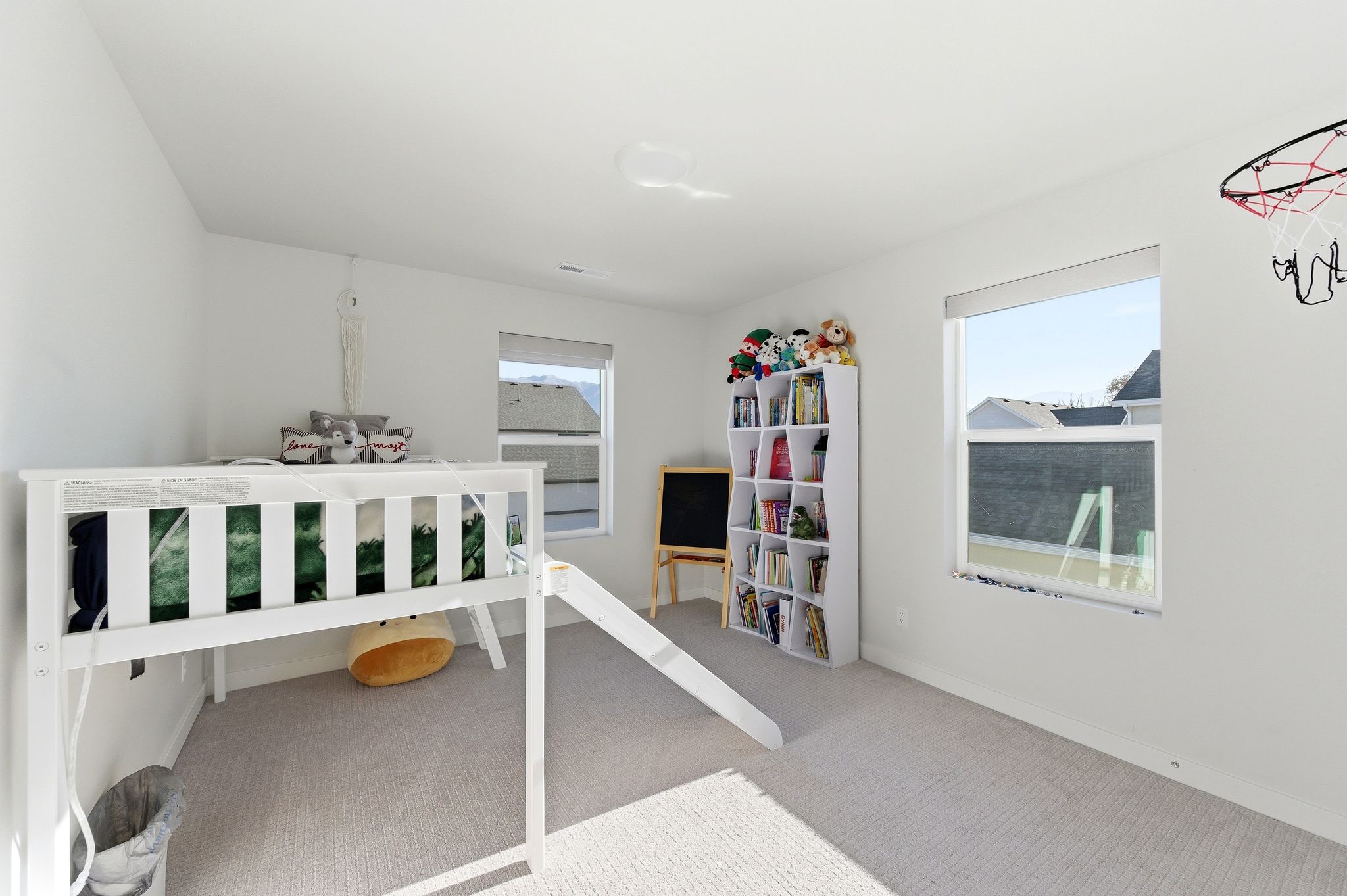 Bright room with carpet flooring and white walls
