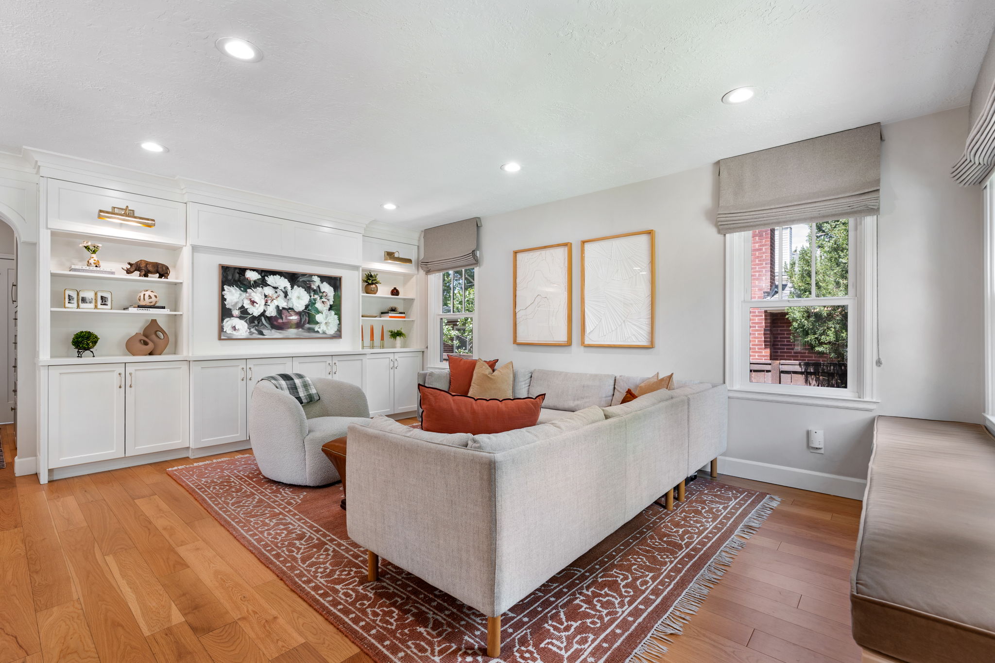 Living area featuring wood-finish flooring and recessed lighting