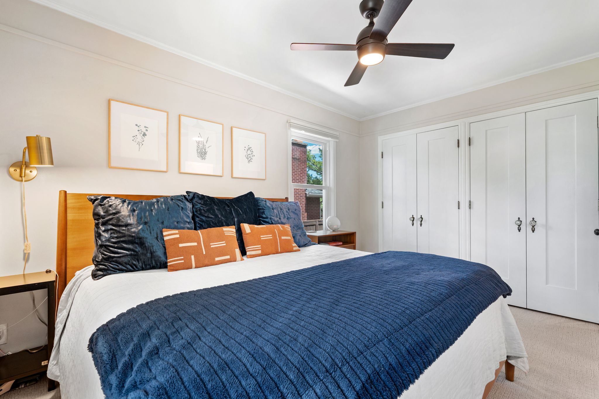 Bright room featuring a ceiling fan with integrated lighting, white trim, and light wall tones