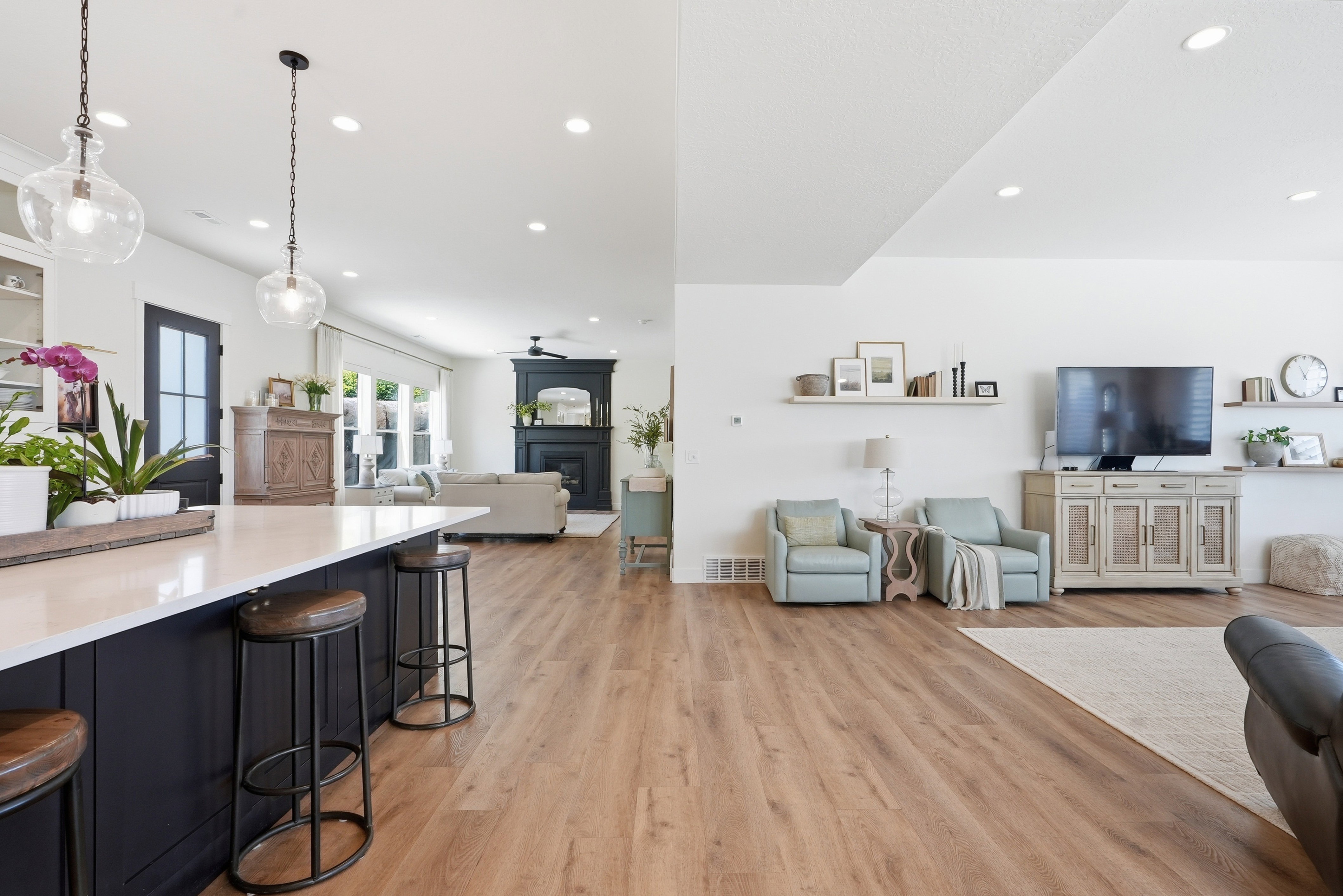 Open-concept living space with light LVP flooring