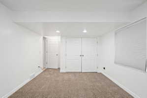Below grade area featuring carpet and recessed lighting