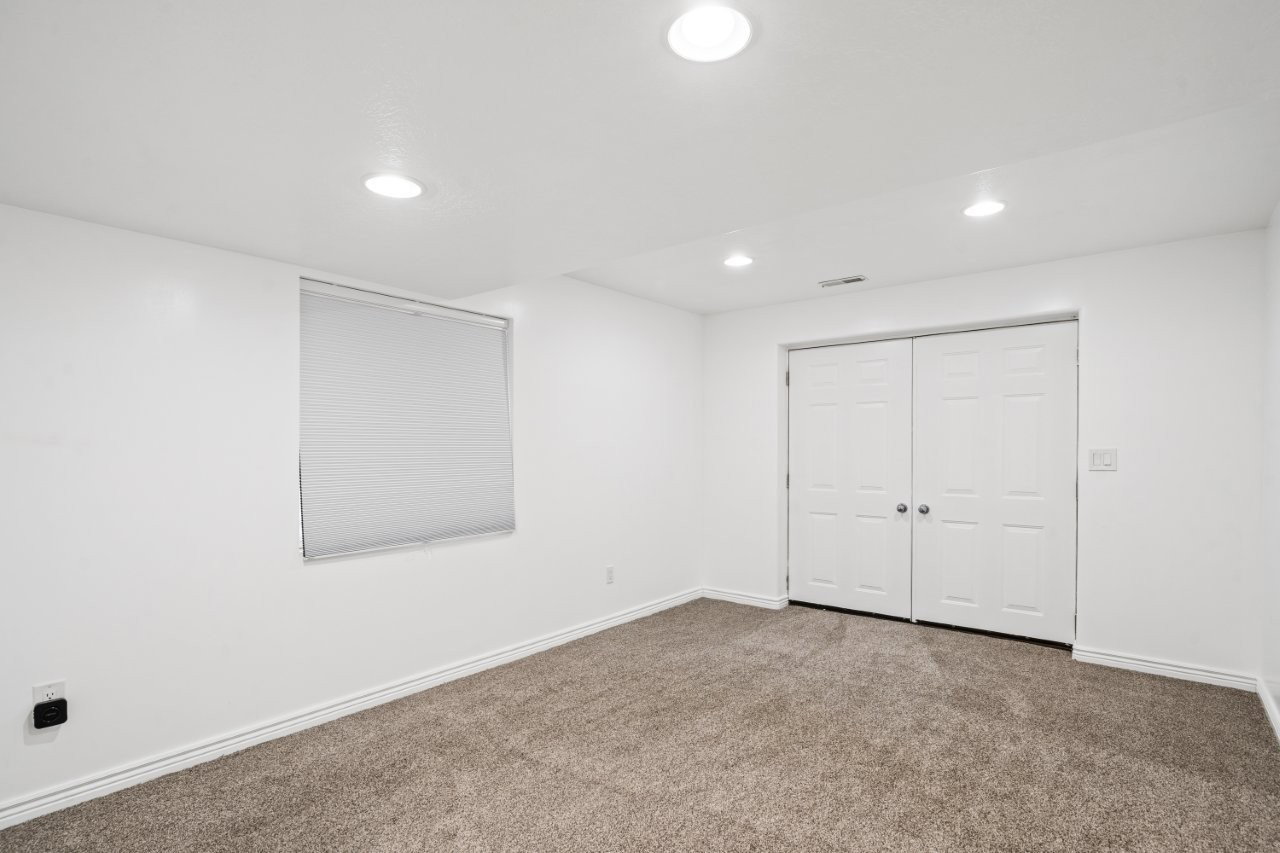 Unfurnished bedroom with carpet, recessed lighting, and a closet