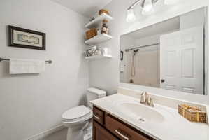 Full bath with vanity and a shower