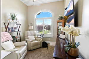 Arch-top window with plantation shutters