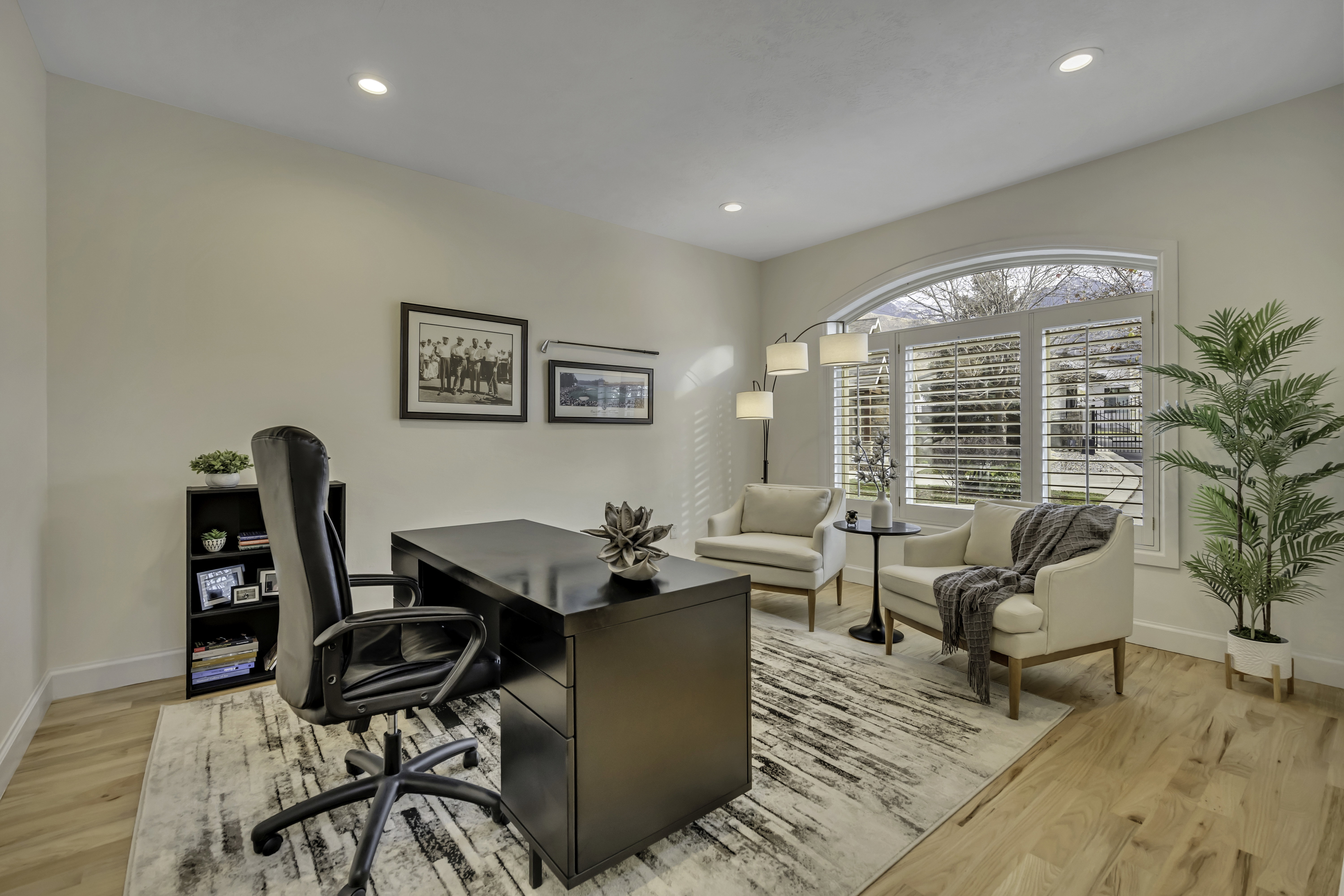 Light wood-finish flooring complements the room's neutral wall tones