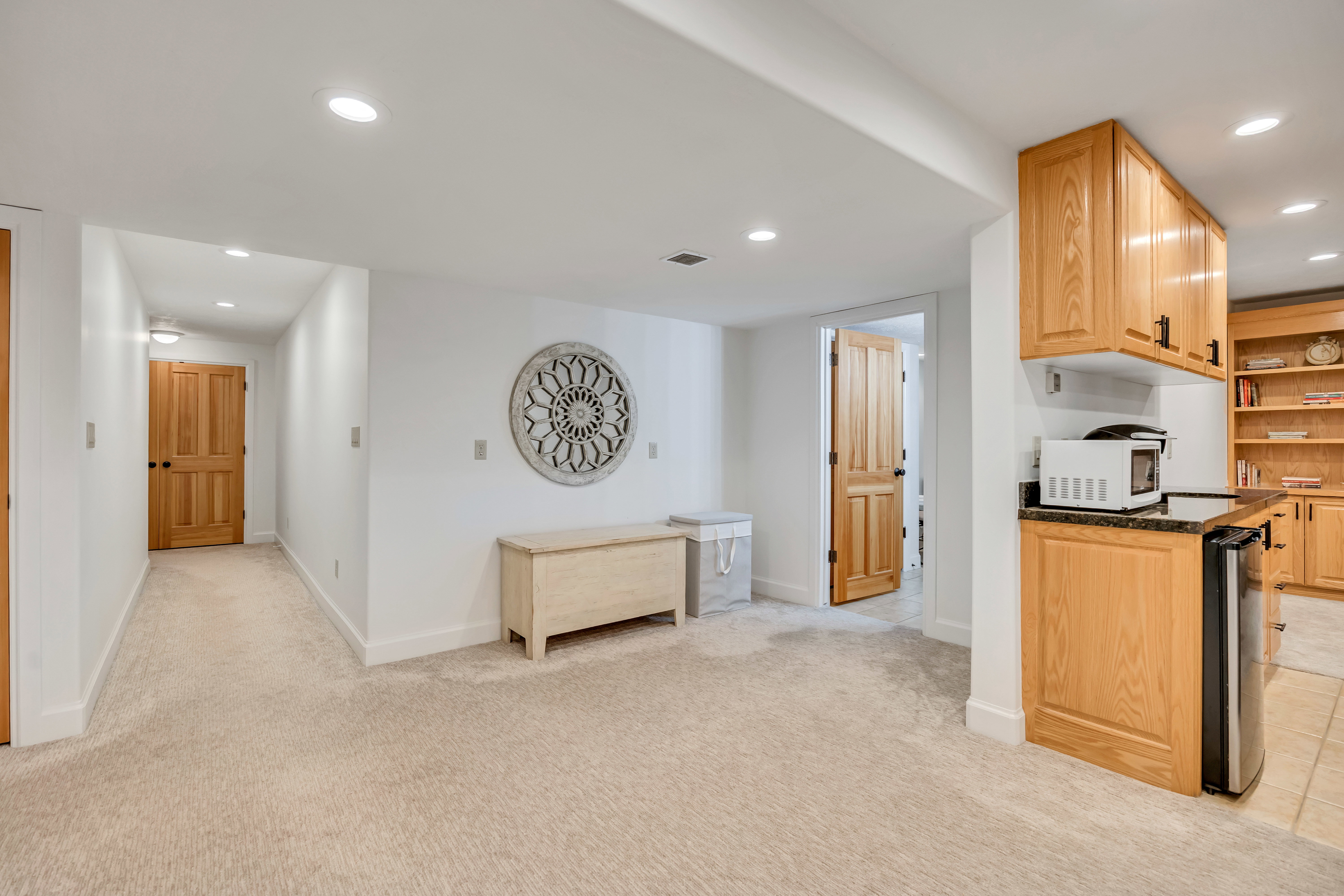 Finished basement featuring carpeted flooring and recessed lighting
