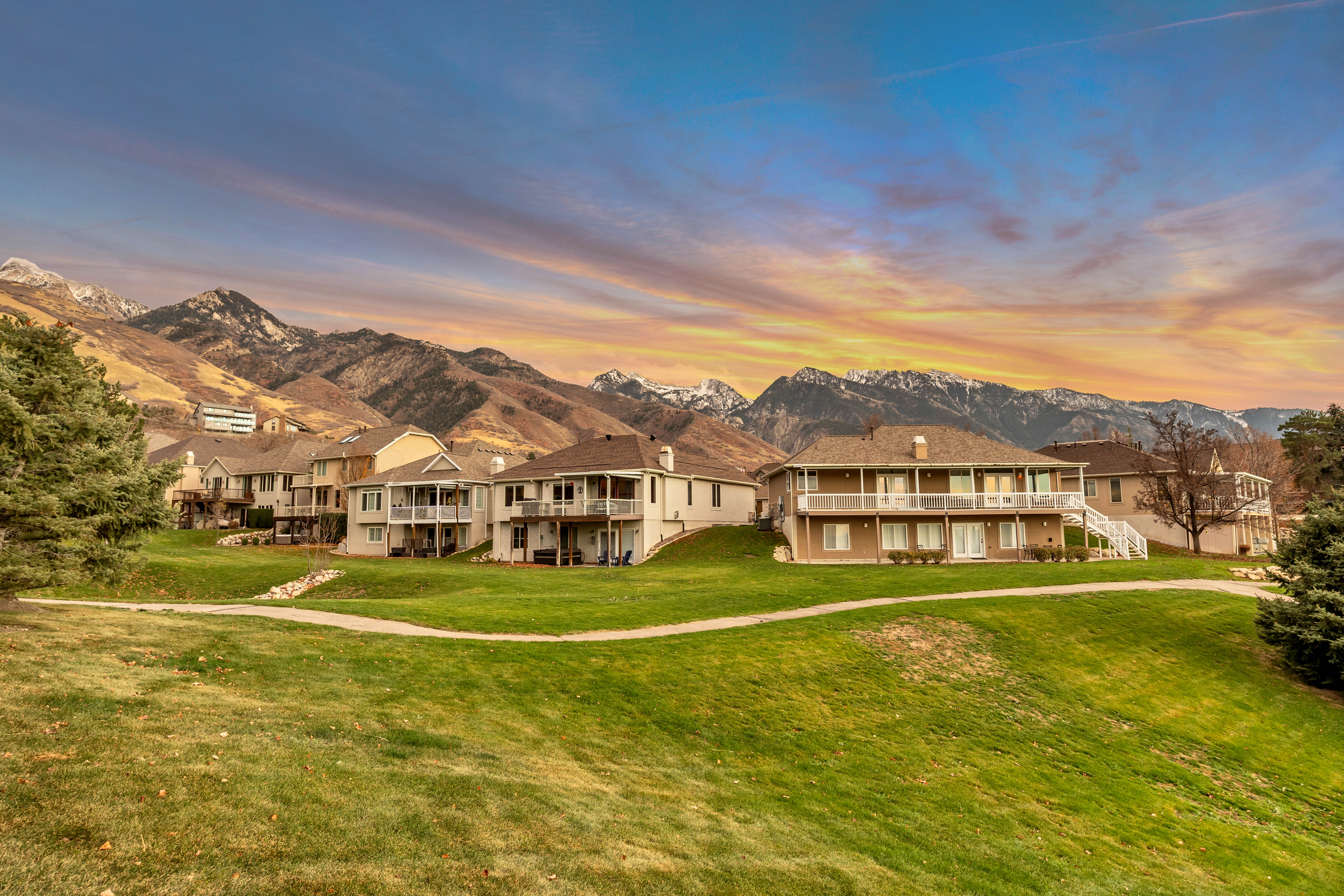 Expansive green lawn with mountain backdrop
