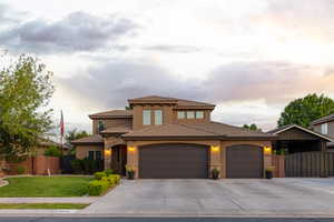 Stucco exterior with stone accents and a tile roof