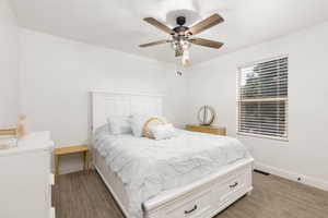 White paneled bed frame with integrated storage drawers