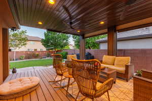 Covered patio featuring wood-finish ceiling, recessed lighting, and dual ceiling fans