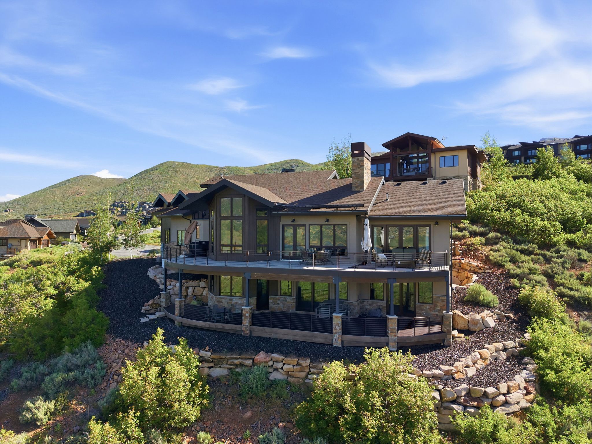 Multi-level exterior with stone and stucco finishes