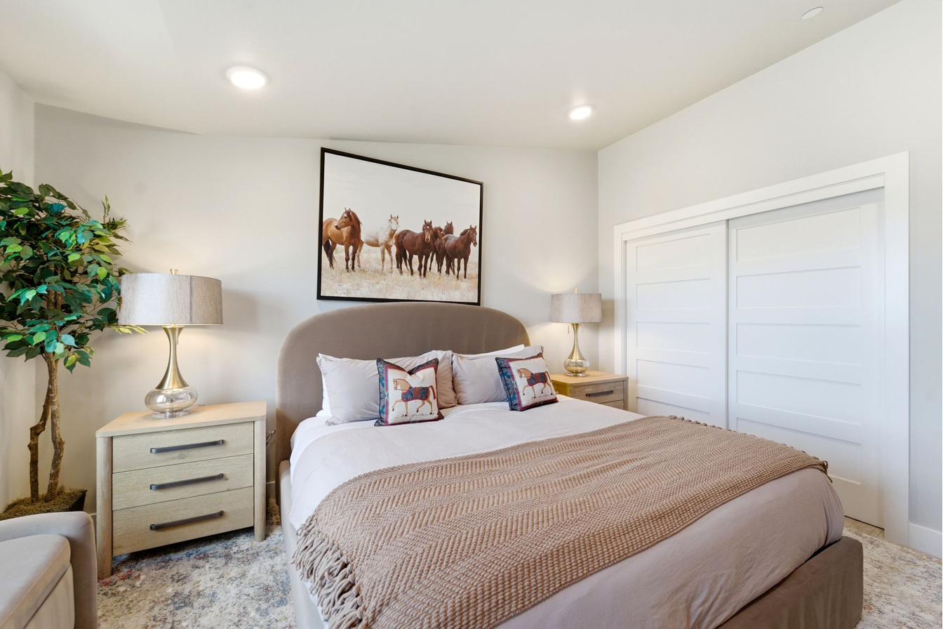 Bedroom featuring light-colored walls and recessed lighting