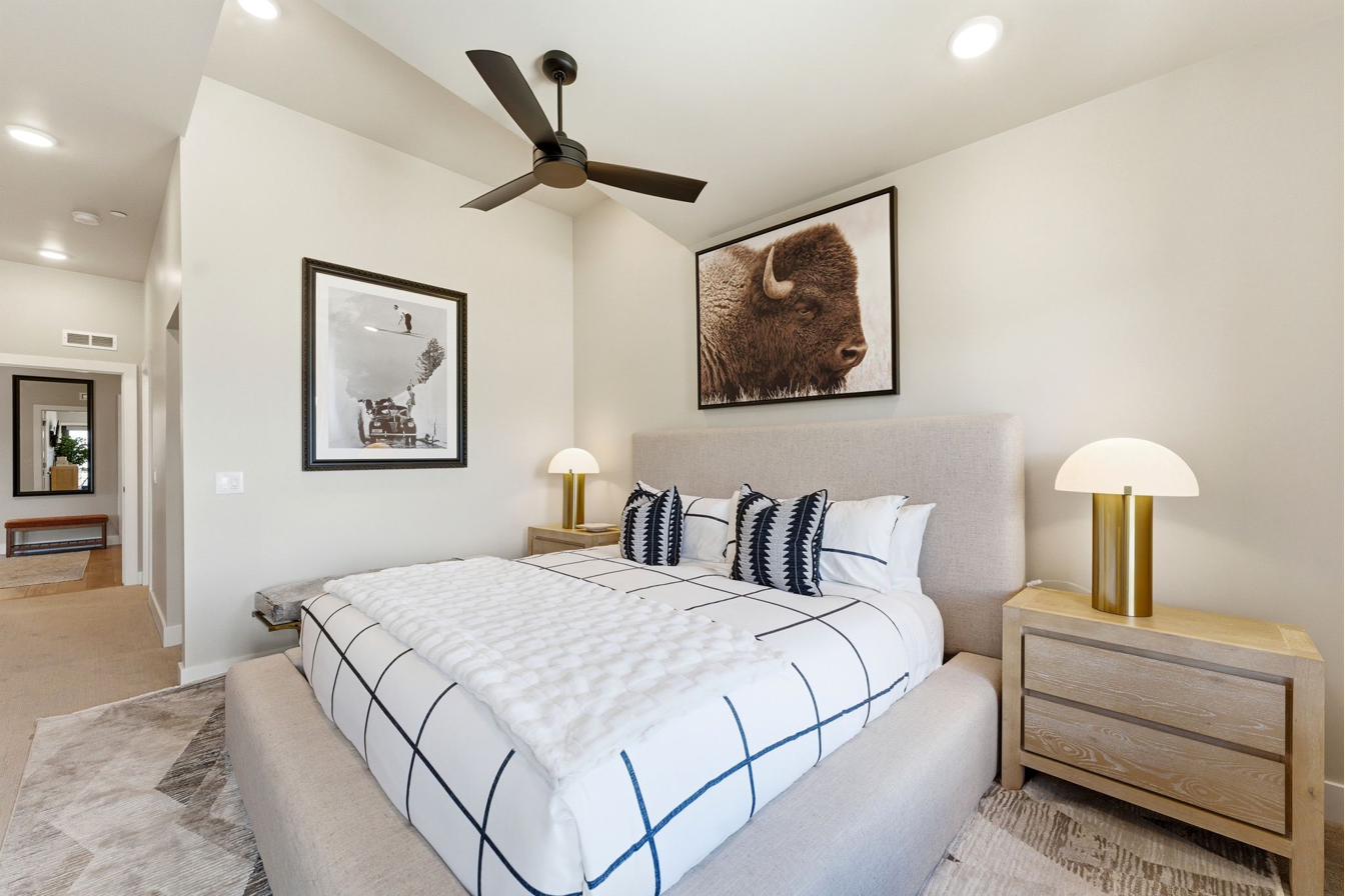 Bedroom featuring a black ceiling fan, recessed lighting, and a neutral color palette
