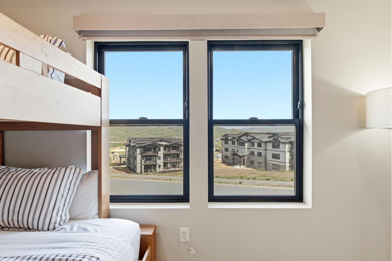 Dual windows with black frames and white trim