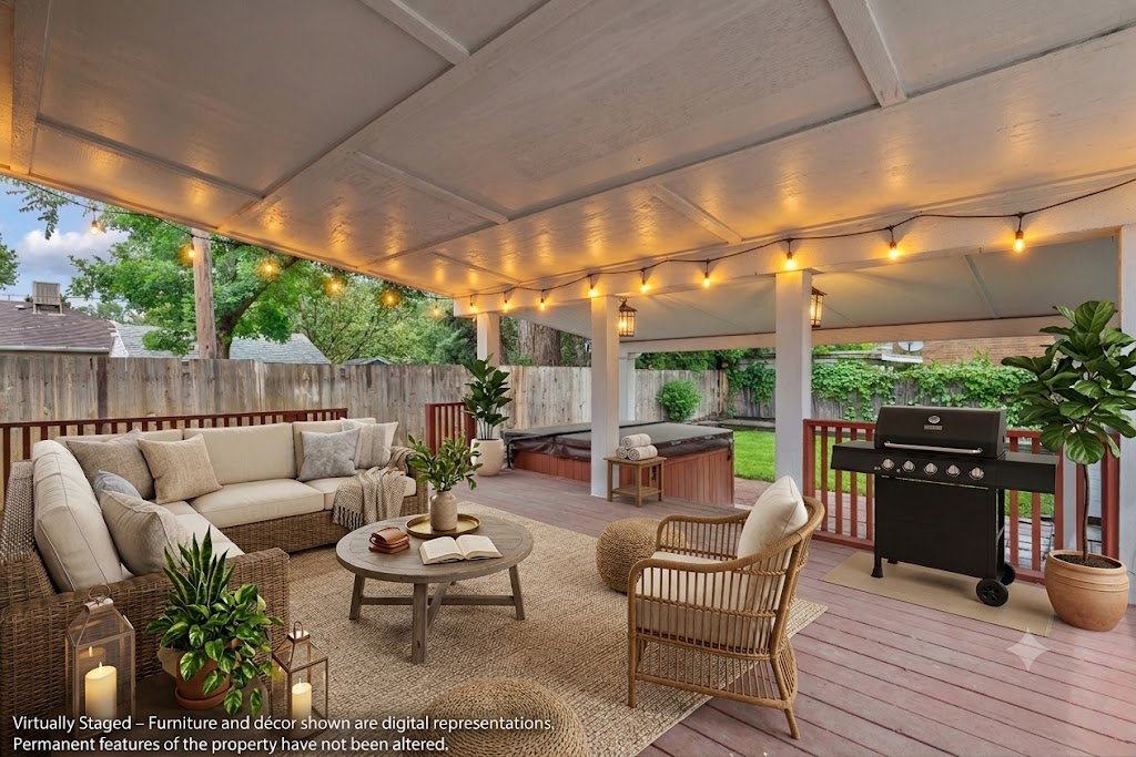 AI stagedExpansive covered deck featuring wood-finish decking, string lighting, and an integrated hot tub