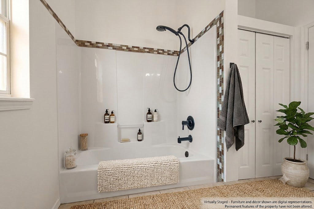 AI staged bathroom - Bathtub with integrated shelving, matte black fixtures, and a decorative tile accent band