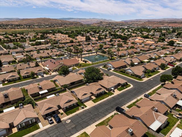 Aerial perspective showcasing a residential community with uniform earth-tone rooflines